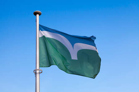 Close-up on the Flag of CoÌtes-d'Armor (Brittany - France) waving on top of a pole.の写真素材