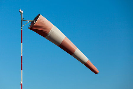 Close-up of an airfield windsock in moderate winds.