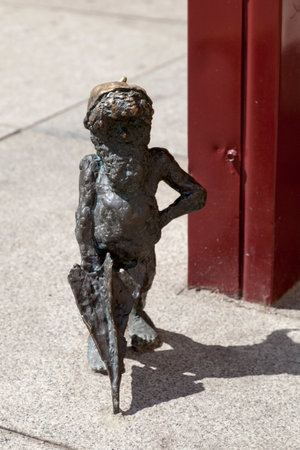 Wroclaw, Poland - June 05 2019: One of the hundreds of Wroclawâs gnomes (Polish: krasnale) in the city center. They are small figurines (20-30 cm) considered as a major tourist attraction.のeditorial素材