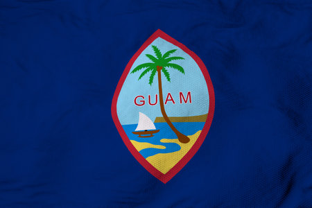 Full frame close-up on a waving flag of Guam in 3D rendering.の写真素材