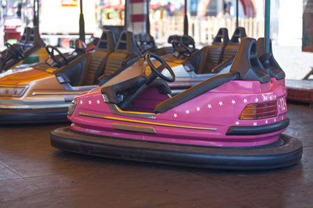 Some empty Bumper cars at a traveling carnival