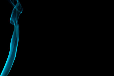 Abstract cyan smoke on black background.の写真素材