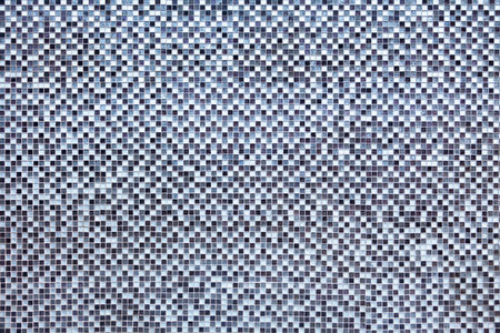 Close-up on a white and blue square bathroom tiles pattern