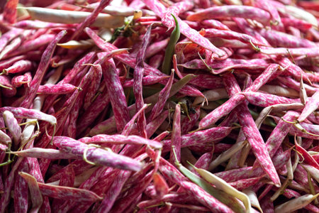 Close-up on a stack of Borlotti beans on a market stall.