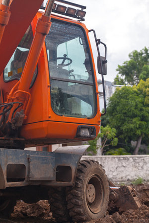 Close-up on the cabin of a Hydraulic excavator at a construction site.の写真素材