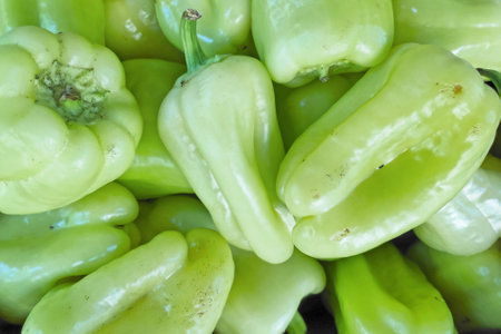 Close-up on a stack of White sweet pepper (aka: Sweet SlÃ¡vy) for sale on a market stall.の写真素材