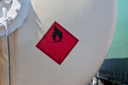 Dangerous goods sign on a tank truck back. The red placard indicate the good trasported is a Flammable Gas.の写真素材