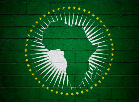 Flag of the African Union painted on a cinder block wall.の写真素材