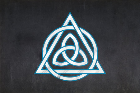 Blackboard with a the Triquetra (inside of an interlaced Christian Trinitarian symbol) drawn in the middle.の写真素材