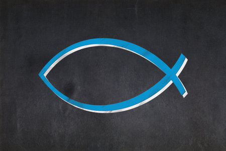 Blackboard with the Ichthys (also known as the "sign of the fish" or the "Jesus fish") drawn in the middle.の写真素材