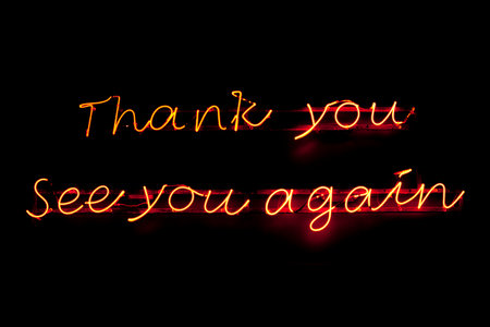 A neon light shaped into the phrase "Thank you See you again".の写真素材
