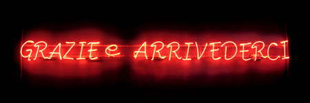 A neon light shaped into the italian phrase "grazie e arrivederci", which means "thank you and see you again".の写真素材