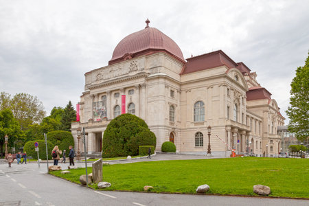 Graz, Austria - May 28 2019: People walking opposite the Graz Opera (German: Oper Graz), opera house. The orchestra of the opera house also performs concerts as the Graz Philharmonic Orchestra (Grazer Philharmonisches Orchester).のeditorial素材