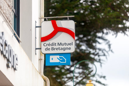 Huelgoat, France - April, 20 2023: Sign of CrÃ©dit Mutuel de Bretagne. The bank is part of CrÃ©dit Mutuel ArkÃ©a, a cooperative and mutual bancassurance group in France.のeditorial素材