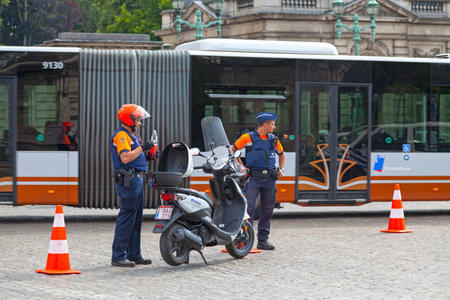 Brussels, Belgium - July 02 2019: Two police officers outside of the Royal Palace.