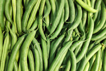 Close-up on a stack of Green beans in a market stall.の写真素材