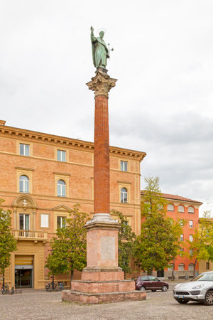 Bologna, Italy - April 03 2019: The column with the bronze statue of St Dominic (1627) outside of the Basilica of San Domenico.のeditorial素材