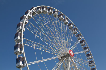 Geneva, Switzerland - June 11 2018: Ferris wheel with the Swiss flag on its center near the Geneva Lake.のeditorial素材