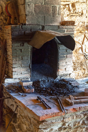 Old forge and a set of tools for a blacksmith.の写真素材