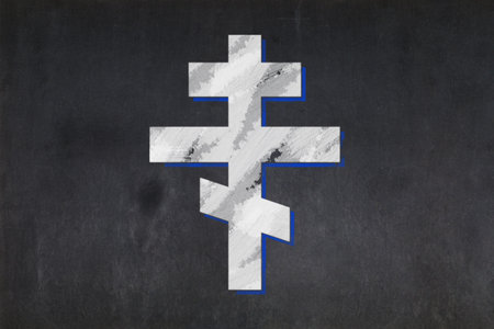 Blackboard with the cross symbol from the Russian Orthodox drawn in the middle.の写真素材