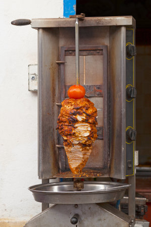 Close-up on a traditional Turkish Doner Kebab grill.の写真素材