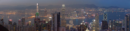 Hong Kong, China - March 26 2014: Kowloon and Victoria Harbour viewed from Victoria Peak at dusk.