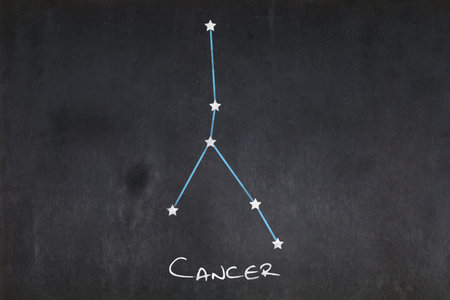 Blackboard with the Cancer constellation drawn in the middle.の写真素材