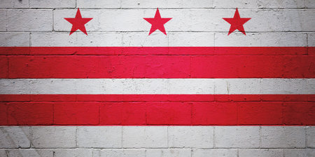 Flag of Washington DC painted on a cinder block wall.