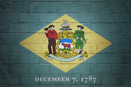 Flag of Delaware painted on a cinder block wall.の写真素材