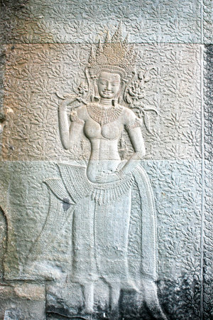 Bas relief of an Apsara dancer carved on a wall in Angkor Wat, Cambodia.