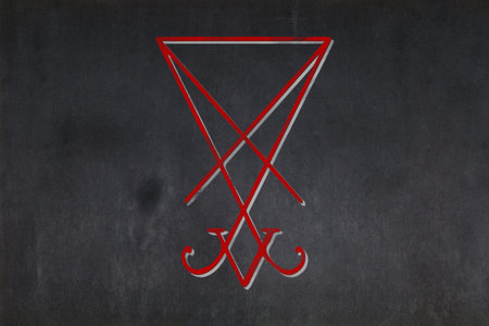 Blackboard with the Sigil of Lucifer drawn in the middle.