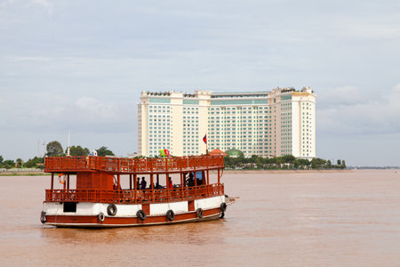 Phnom Penh, Cambodia - August 26 2018: Passenger boat navigating on the Mekong River.のeditorial素材