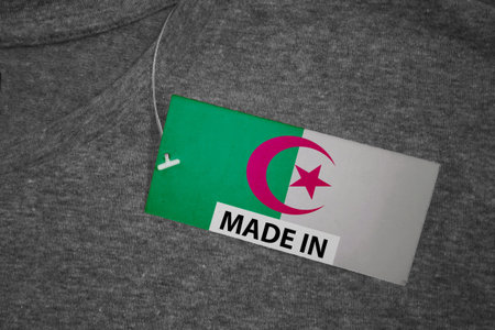 A â€œMade in Algeriaâ€ tag attached to a t-shirt.