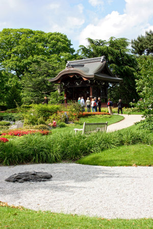 London, England - May 19 2007: People walking around the Japanese Gateway (Chokushi-Mon) in Kew Gardens in London.のeditorial素材