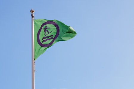 Green flag indicating it is allowed to surf.の写真素材