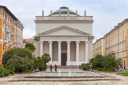 Trieste, Italy - April 08 2019: The Church of Sant'Antonio Taumaturgo (Italian: Chiesa Parrocchiale Sant'Antonio Taumaturgo) is an imposing neoclassical church, built in the 19th century, with soaring Ionic columns & a domed roof.のeditorial素材