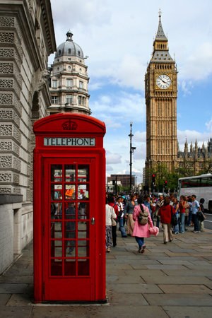 London, England - August 19 2006: Traditional red british phone booth in front of Big Ben.のeditorial素材
