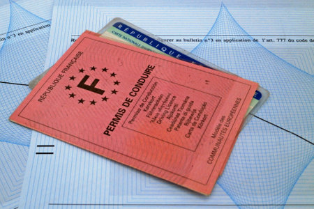 A french driver's license and ID card on the top of a French criminal record (Bulletin nÂ°3). This bulletin contains only convictions for felony or misdemeanor to imprisonment of more than two years without suspended sentence.の写真素材