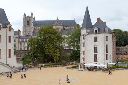 Nantes, France - July 26 2017: La Conciergerie (Caretaker's Lodge) with behind, the CatheÌdrale Saint-Pierre-et-Saint-Paul (Nantes Cathedral).のeditorial素材