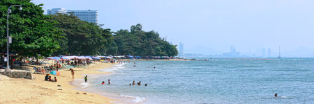 Jomtien Beach, Thailand - November 01 2011: Tourists and locals enjoying the sun on Jomtien Beach, a popular resort on the gulf of Thailand.のeditorial素材