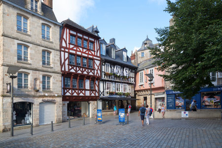 Quimper, France - July 24 2022: Half-timbered town houses located Place Saint-Corentin.のeditorial素材