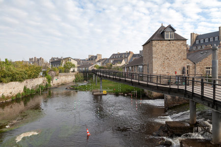 Passerelle sur le Trieux is a footbridge over the river Le Trieux at Guingamp with the island of St Michel to its left.の写真素材