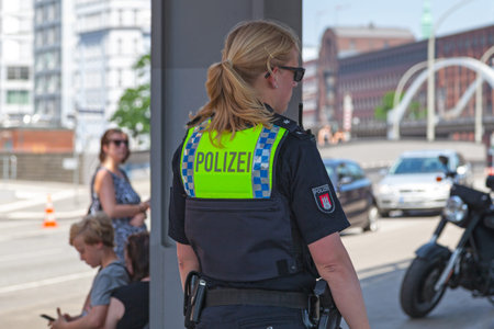 Hamburg, Germany - June 30 2019: Policewoman in patrolling the streets.