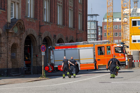 Hamburg, Germany - June 30 2019: Fire truck entering inside the downtown Fire and rescue station...