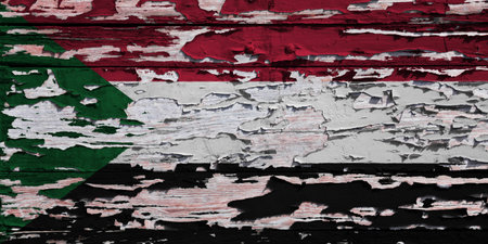 Flag of Sudan painted on a grunge wooden board.の写真素材