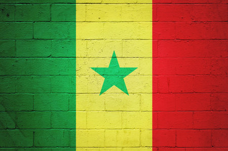 Flag of Senegal painted on a brick wall.の写真素材