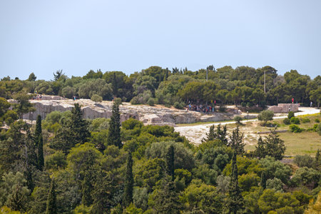 Athens, Greece - April 28 2019: The Pnyx (Greek: Î Î½ÏÎºÎ±, Pnyka) is a hill opposite the Acropolis where the Athenians gathered to host their popular assemblies. The hill is one of the earliest and most important sites in the creation of democracy.のeditorial素材