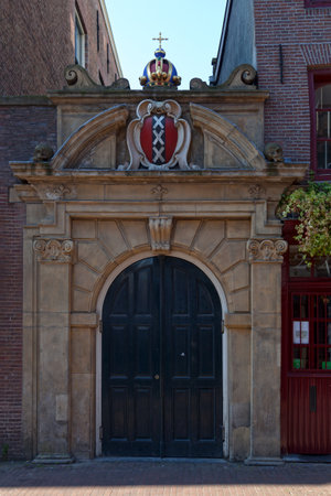 Amsterdam, Netherlands - August 27 2017: Northern gate of the Walloon Church, a Protestant church building  along the southern stretch of Oudezijds Achterburgwal canal.のeditorial素材