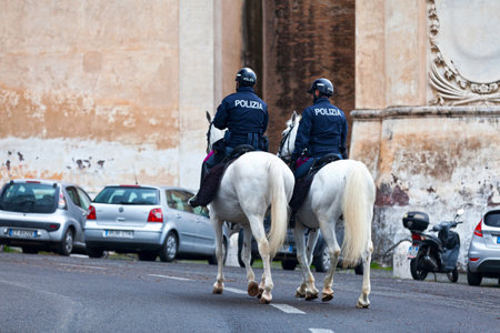 Rome, Italy - March 20 2018: Two police officers horseriding opposite of the Church of San Pietro in Montorio.のeditorial素材
