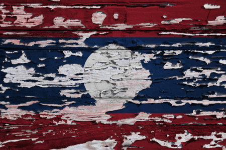 Flag of Laos a painted on a grunge wooden board.の写真素材
